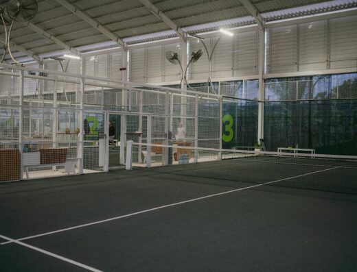 Indoor mesh-walled padel courts at Canggu Padel Centre