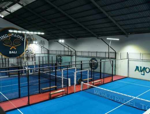 Indoor blue padel courts with branding at INDOPADEL Bali
