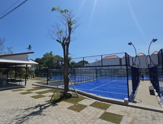 Outdoor blue glass-walled padel courts at Paradise Padel Bali