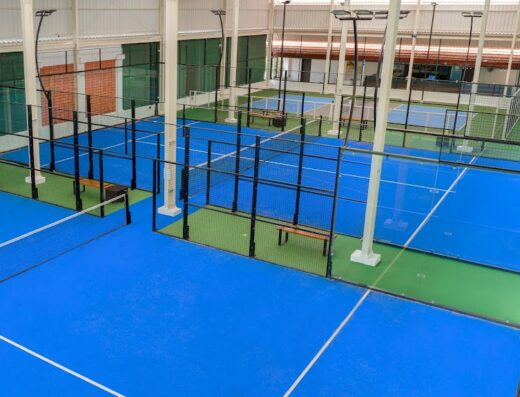 Rows of glass-walled indoor padel courts at Prime Padel & Pickle Sanur