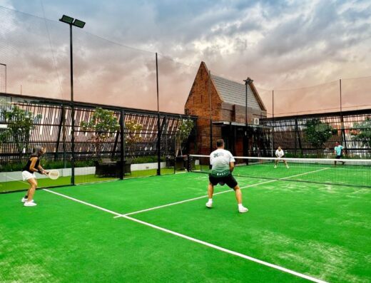 Players in a doubles match on the turf padel court at Sky Padel Kuta