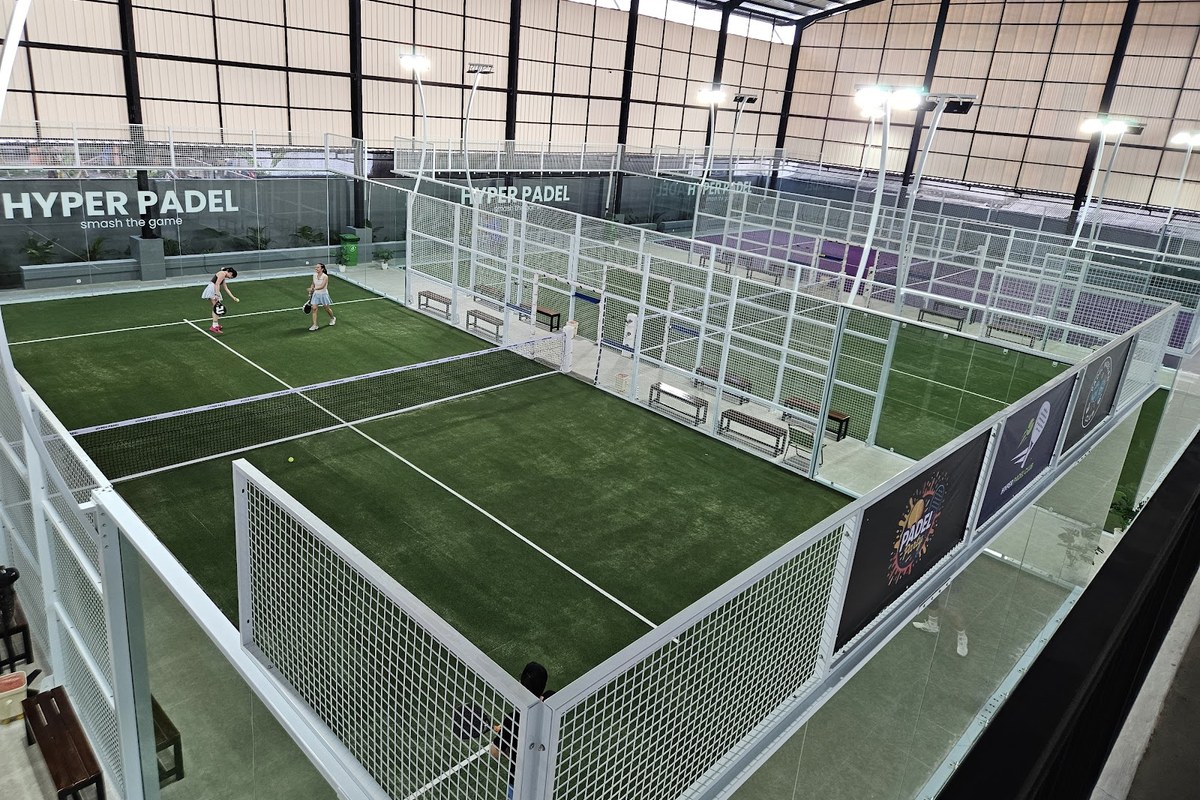 Multiple indoor padel courts with players at Hyper Padel Tangerang in the BSD area of Greater Jakarta